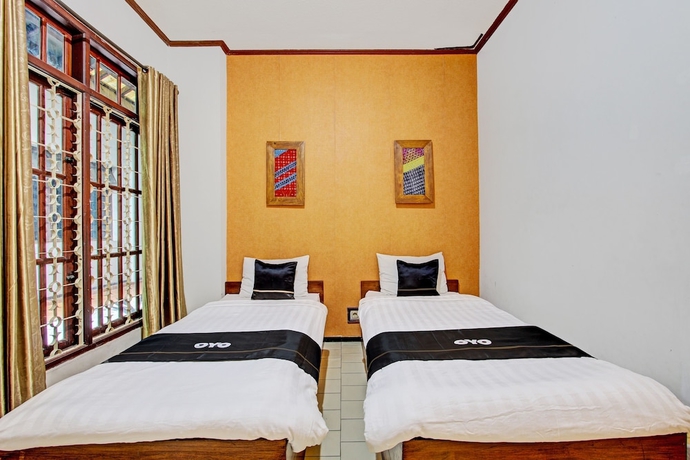 Imagen de la habitación del Hotel Capital O 93240 Candra Dewi. Foto 6