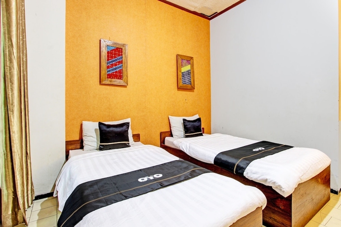 Imagen de la habitación del Hotel Capital O 93240 Candra Dewi. Foto 7