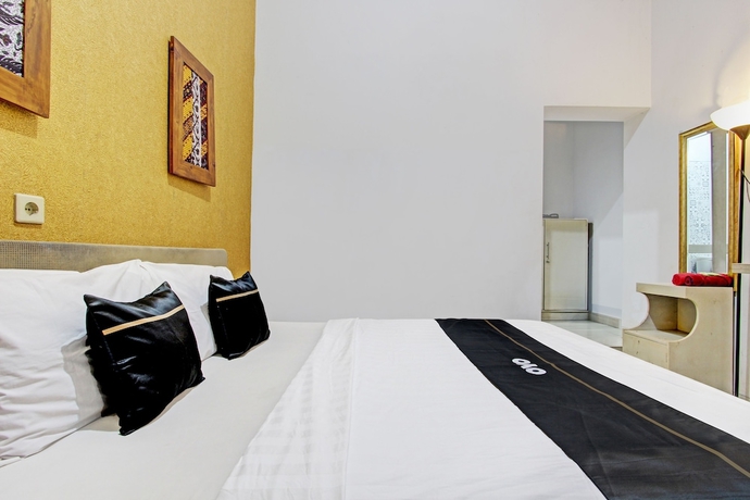 Imagen de la habitación del Hotel Capital O 93240 Candra Dewi. Foto 8