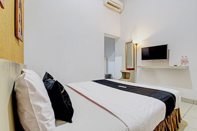 Imagen de la habitación del Hotel Capital O 93240 Candra Dewi. Foto 9