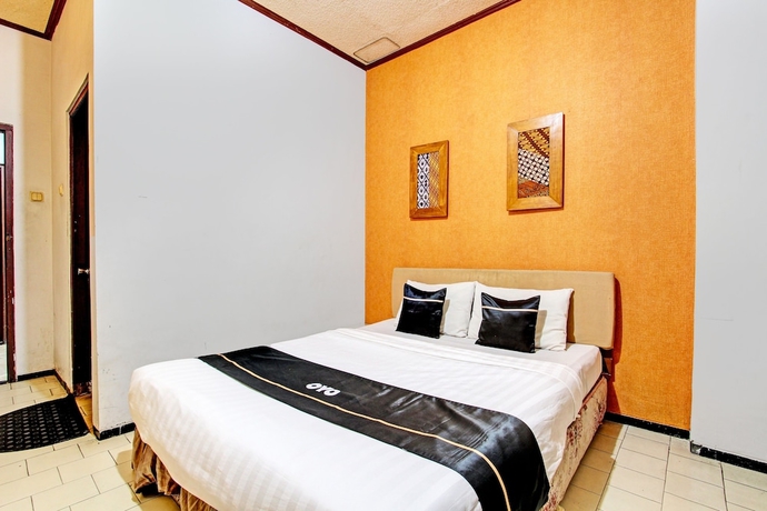 Imagen de la habitación del Hotel Capital O 93240 Candra Dewi. Foto 10