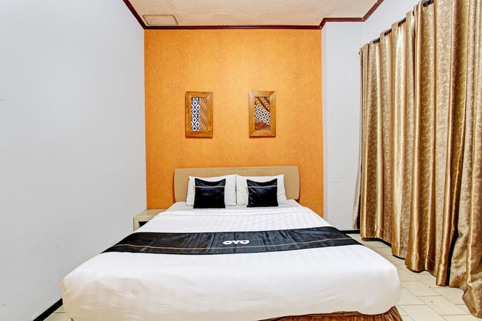 Imagen de la habitación del Hotel Capital O 93240 Candra Dewi. Foto 11