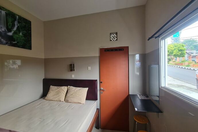 Imagen de la habitación del Hotel Capital O 93250 Tirta Kencana 2 Baturaden. Foto 19