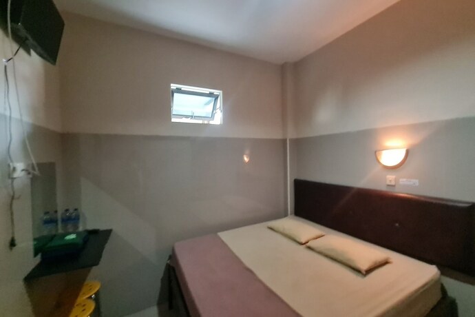 Imagen de la habitación del Hotel Capital O 93250 Tirta Kencana 2 Baturaden. Foto 20