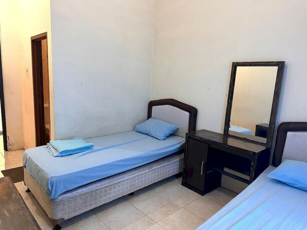 Imagen de la habitación del Hotel Capital O 93273 Rani Villa. Foto 19