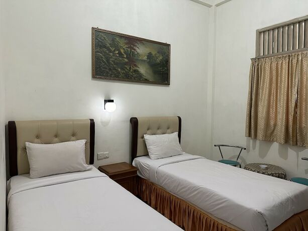 Imagen de la habitación del Hotel Capital O 93291 Bintang. Foto 17