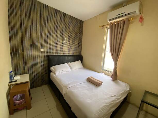 Imagen de la habitación del Hotel Capital O 93291 Bintang. Foto 18