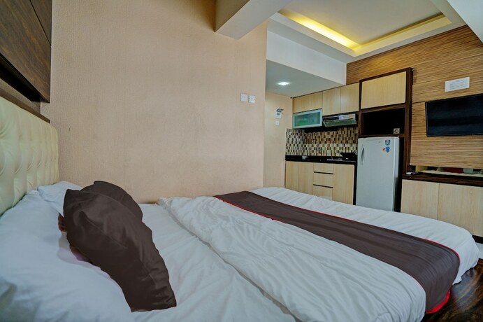 Imagen de la habitación del Hotel Capital O 93344 Gateway Pasteur Apartement By Maestro. Foto 17