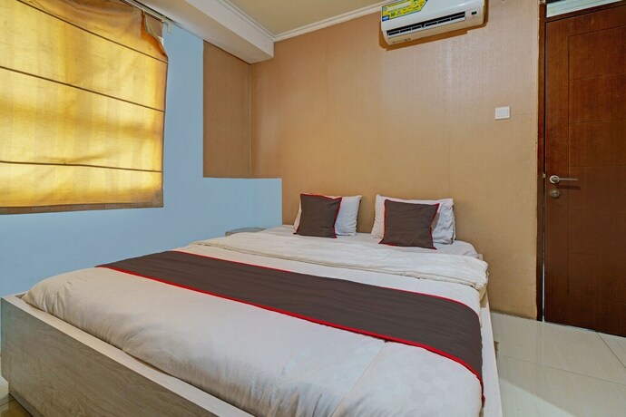 Imagen de la habitación del Hotel Capital O 93344 Gateway Pasteur Apartement By Maestro. Foto 19