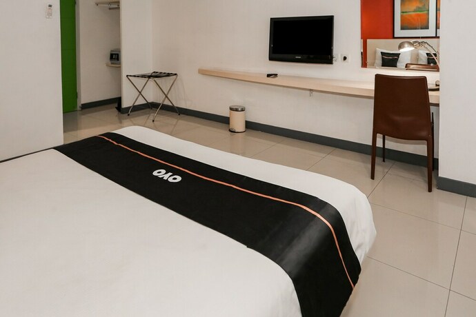 Imagen de la habitación del Hotel Capital O 93347 Glodok Inn By Nam. Foto 19