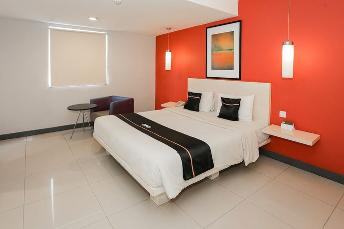 Imagen de la habitación del Hotel Capital O 93347 Glodok Inn By Nam. Foto 25