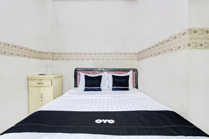 Imagen de la habitación del Hotel Capital O 93361 Dynasty Inn Syariah. Foto 17