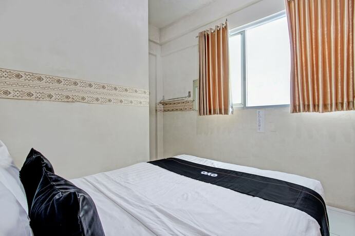 Imagen de la habitación del Hotel Capital O 93361 Dynasty Inn Syariah. Foto 19