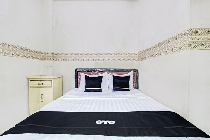 Imagen de la habitación del Hotel Capital O 93361 Dynasty Inn Syariah. Foto 20