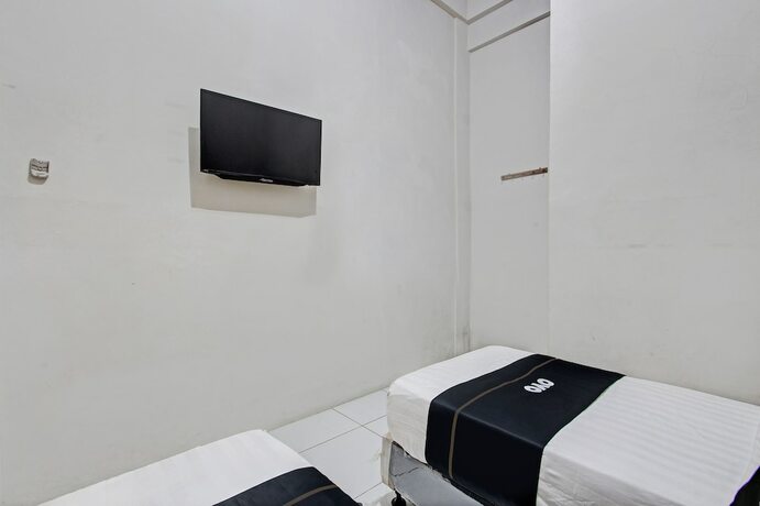Imagen de la habitación del Hotel Capital O 93361 Dynasty Inn Syariah. Foto 22