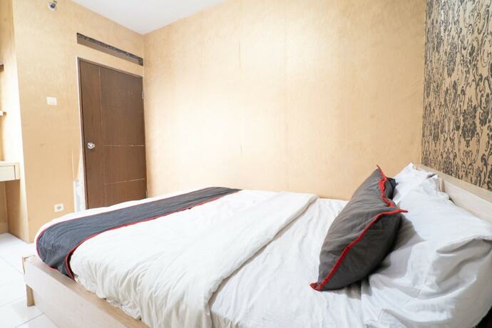 Imagen general del Hotel Capital O 93434 Apartement Gateway Cicadas By MGM II Property. Foto 6