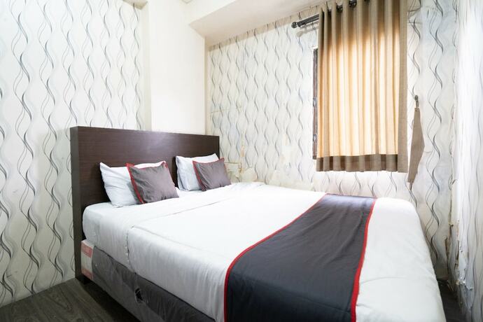 Imagen de la habitación del Hotel Capital O 93434 Apartement Gateway Cicadas By MGM II Property. Foto 17