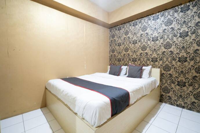 Imagen de la habitación del Hotel Capital O 93434 Apartement Gateway Cicadas By MGM II Property. Foto 18