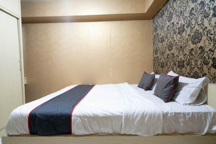 Imagen de la habitación del Hotel Capital O 93434 Apartement Gateway Cicadas By MGM II Property. Foto 20