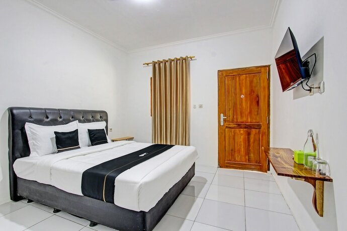 Imagen de la habitación del Hotel Capital O 93449 The Boekit Song Putri. Foto 17