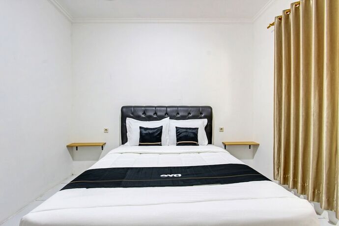 Imagen de la habitación del Hotel Capital O 93449 The Boekit Song Putri. Foto 19