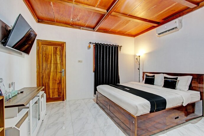 Imagen de la habitación del Hotel Capital O 93449 The Boekit Song Putri. Foto 20