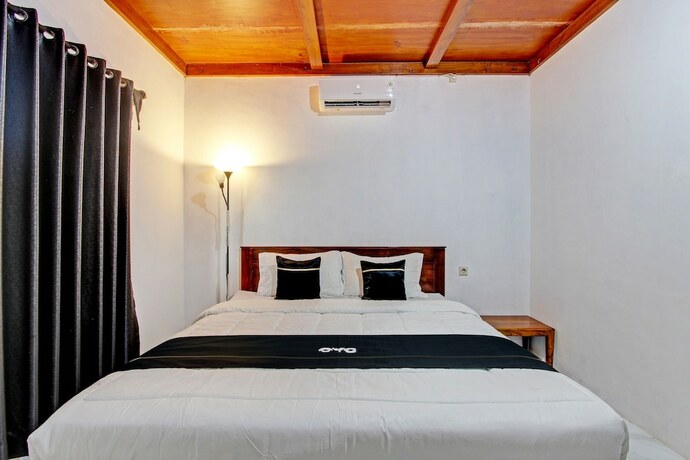 Imagen de la habitación del Hotel Capital O 93449 The Boekit Song Putri. Foto 21