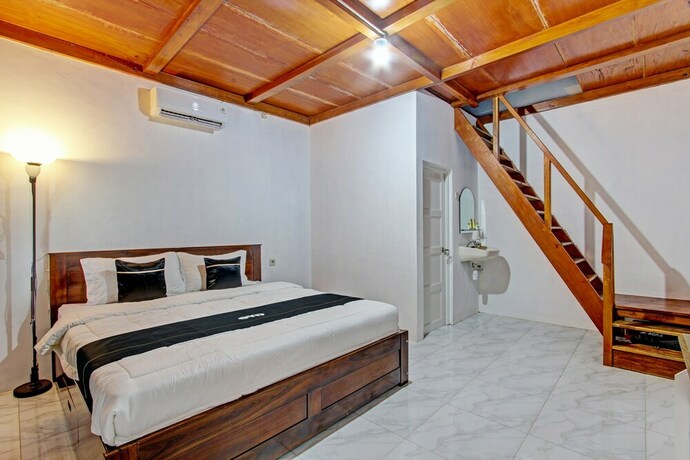 Imagen de la habitación del Hotel Capital O 93449 The Boekit Song Putri. Foto 22
