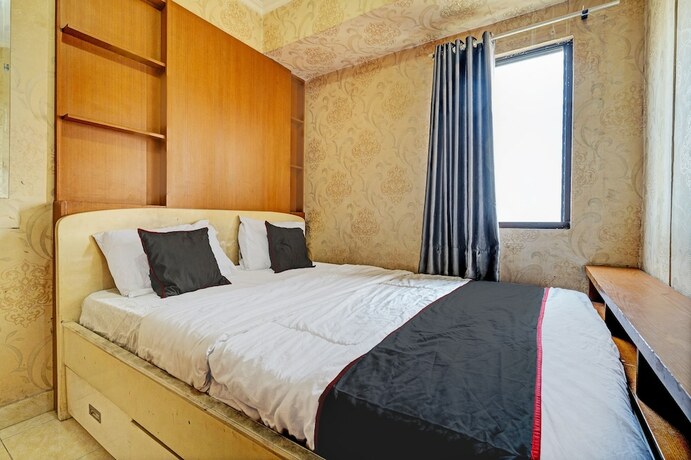 Imagen de la habitación del Hotel Capital O 93455 Apartement Gateway Cicadas By Az Pro Ii. Foto 18