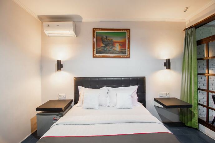 Imagen de la habitación del Hotel Capital O 93486 Anna Inn Kuta. Foto 18
