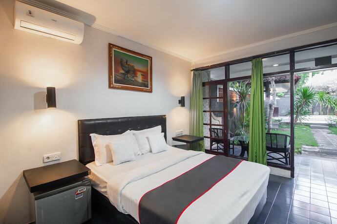 Imagen de la habitación del Hotel Capital O 93486 Anna Inn Kuta. Foto 19