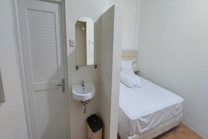 Imagen de la habitación del Hotel Capital O 93489 An Nur Homestay Syariah. Foto 3