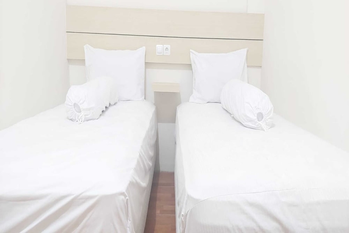 Imagen de la habitación del Hotel Capital O 93489 An Nur Homestay Syariah. Foto 4
