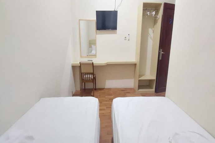 Imagen de la habitación del Hotel Capital O 93489 An Nur Homestay Syariah. Foto 5