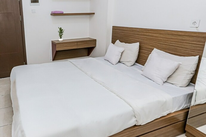 Imagen de la habitación del Hotel Capital O 93516 Loftvilles City Residenc. Foto 26