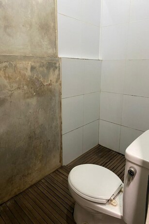 Imagen de la habitación del Hotel Capital O 93529 September House. Foto 20