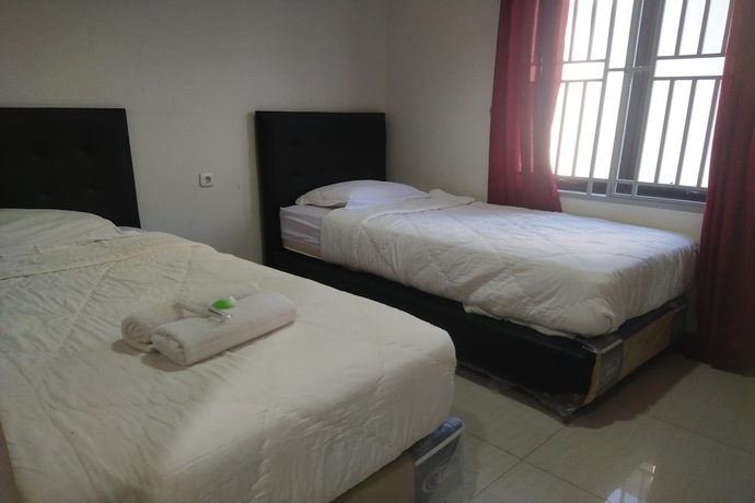 Imagen de la habitación del Hotel Capital O 93589 Wongso Syariah. Foto 2