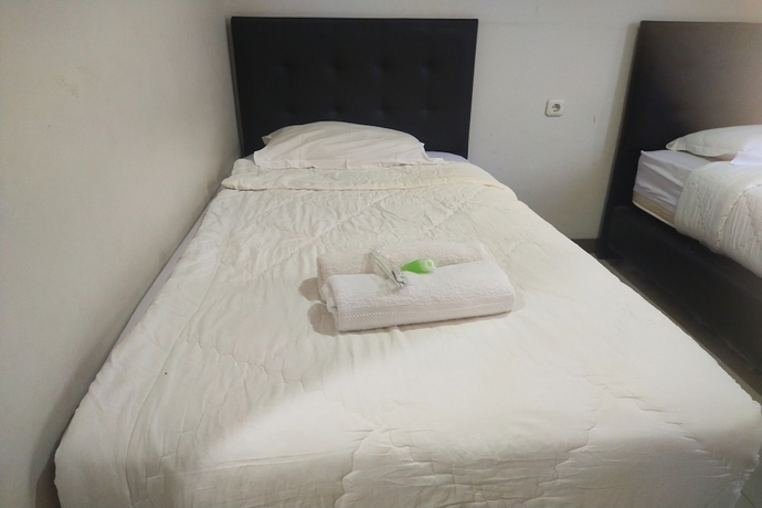 Imagen de la habitación del Hotel Capital O 93589 Wongso Syariah. Foto 3