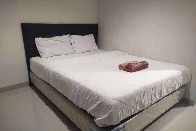 Imagen de la habitación del Hotel Capital O 93589 Wongso Syariah. Foto 4