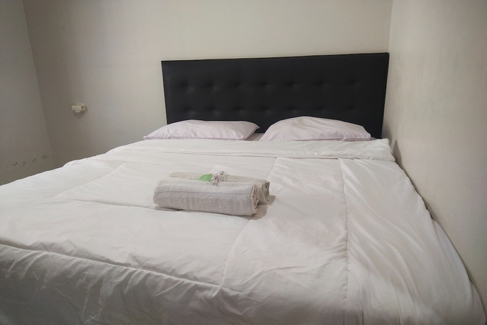 Imagen de la habitación del Hotel Capital O 93589 Wongso Syariah. Foto 6