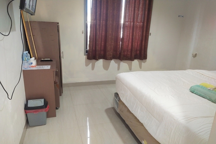 Imagen de la habitación del Hotel Capital O 93589 Wongso Syariah. Foto 9