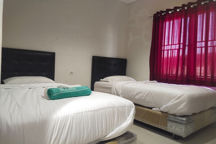 Imagen de la habitación del Hotel Capital O 93589 Wongso Syariah. Foto 10