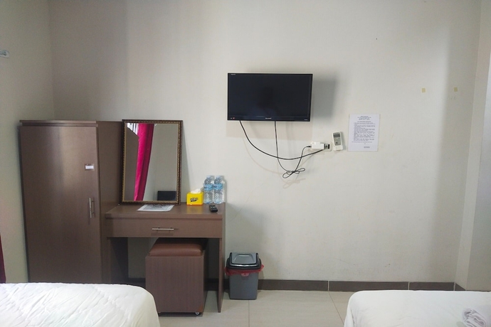 Imagen de la habitación del Hotel Capital O 93589 Wongso Syariah. Foto 11