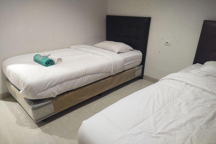 Imagen de la habitación del Hotel Capital O 93589 Wongso Syariah. Foto 12