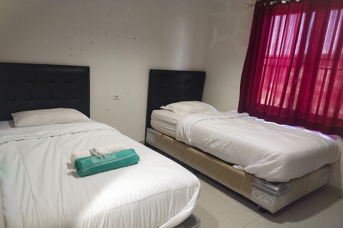 Imagen de la habitación del Hotel Capital O 93589 Wongso Syariah. Foto 13