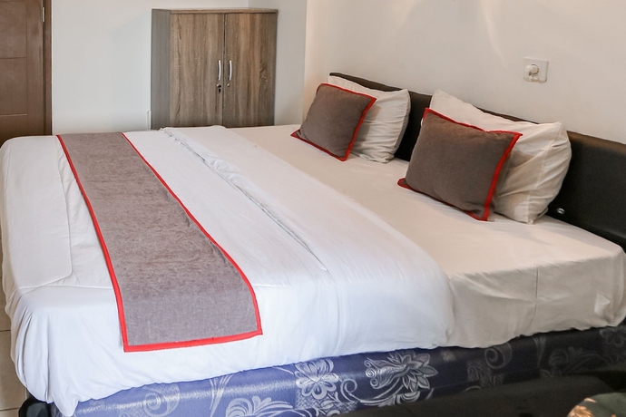 Imagen de la habitación del Hotel Capital O 93593 Pelangi Loftville City. Foto 6