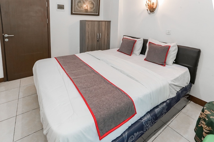Imagen de la habitación del Hotel Capital O 93593 Pelangi Loftville City. Foto 8