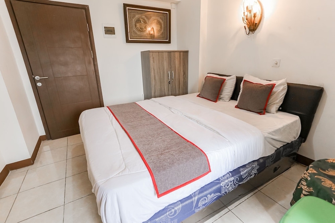 Imagen de la habitación del Hotel Capital O 93593 Pelangi Loftville City. Foto 11