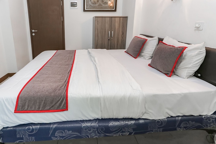 Imagen de la habitación del Hotel Capital O 93593 Pelangi Loftville City. Foto 12
