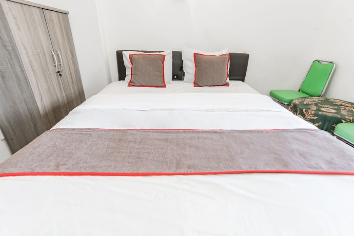 Imagen de la habitación del Hotel Capital O 93593 Pelangi Loftville City. Foto 13